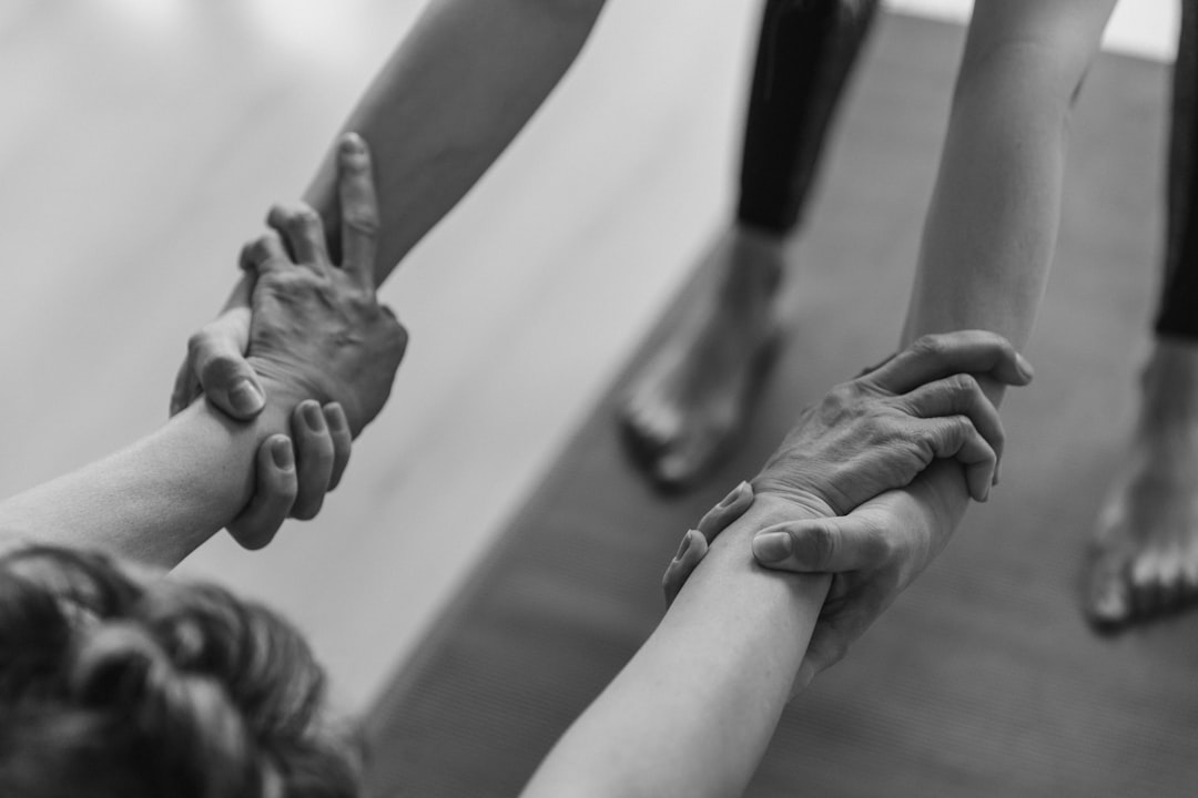 Image must show ONLY what this section discusses: the Feldenkrais method focusing on gentle movement learning to improve body organization. A person is performing a subtle, gentle Feldenkrais movement, perhaps lying on a mat, with an emphasis on internal awareness and precise, small adjustments rather than strenuous exercise. The environment is simple, highlighting the body's organization.. Photorealistic, high-quality photography style. אדם מבצע תנועה עדינה על מזרן, המדגישה למידה תנועתית וארגון גוף בשיטת פלדנקרייז.